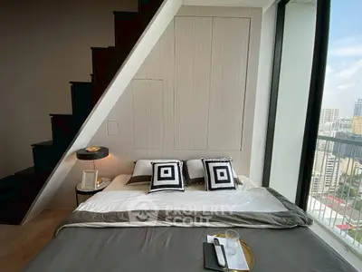 Modern bedroom with city view and stylish decor in high-rise apartment