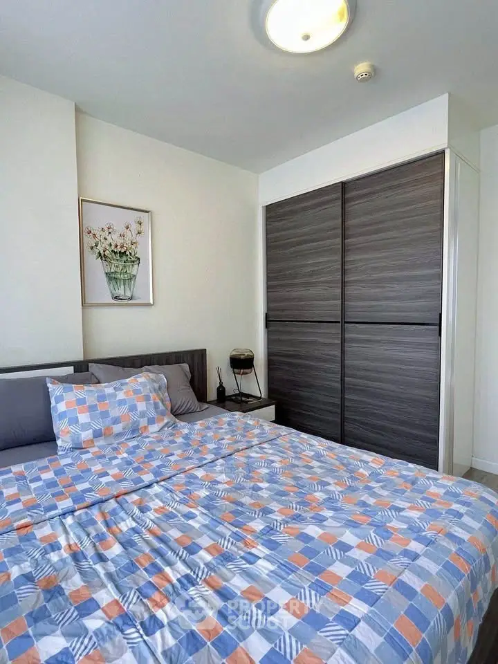 Modern bedroom with stylish bedding and sleek wardrobe design