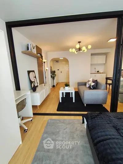 Modern open-plan living room with stylish decor and cozy seating area