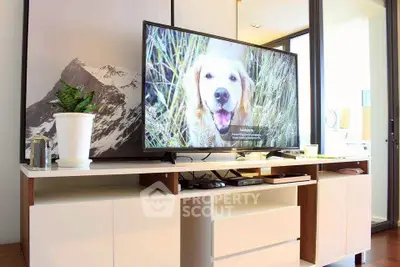 Modern living room with sleek TV stand and mountain artwork