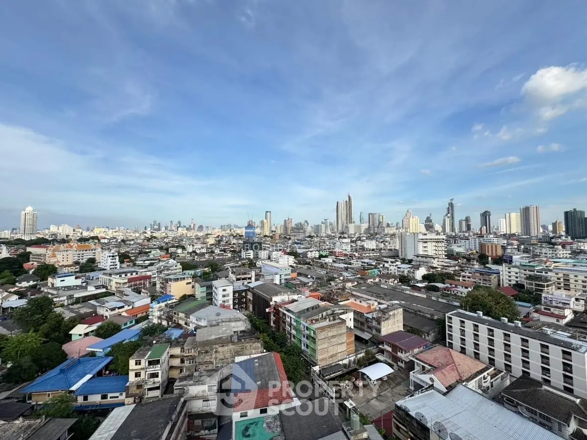 Stunning cityscape view from high-rise building showcasing urban skyline and vibrant neighborhood.