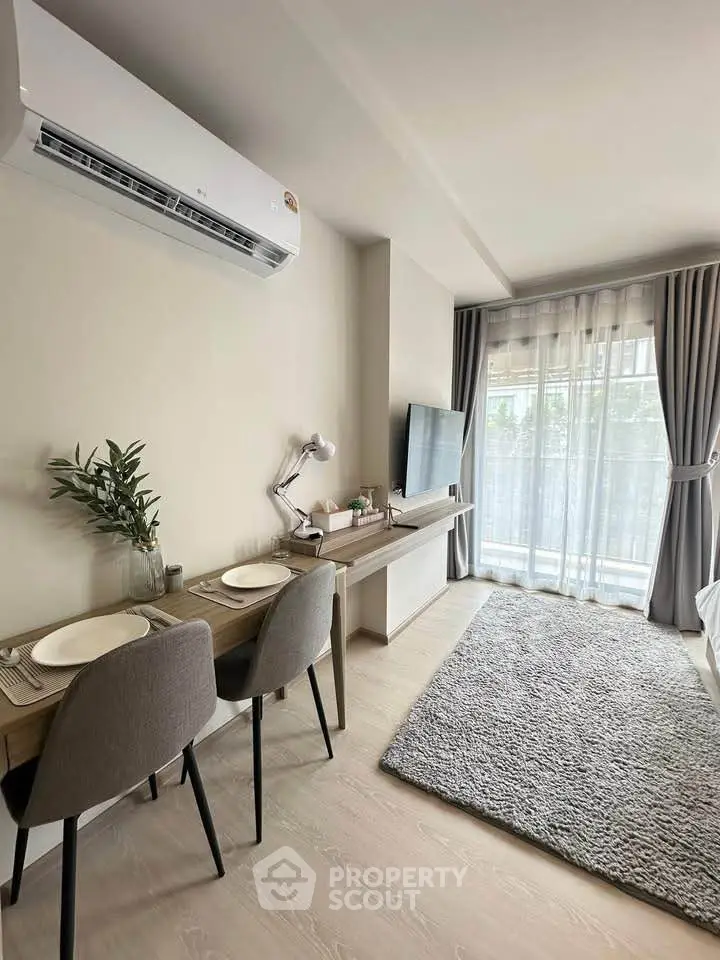 Modern living room with dining area and natural light