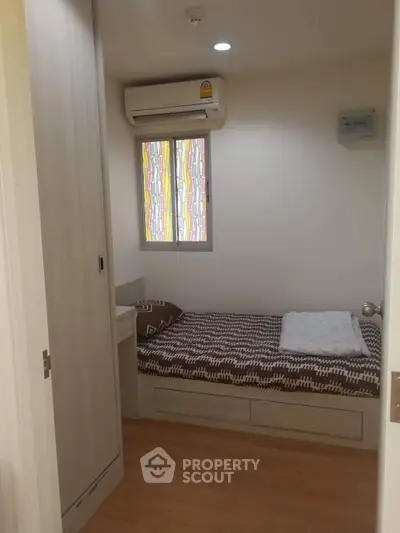 Cozy small bedroom with air conditioning and modern decor