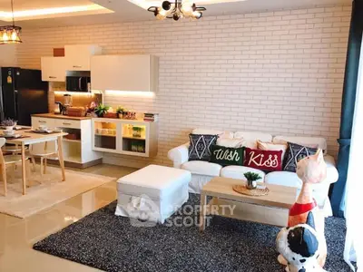 Stylish open-layout living room with modern kitchen and cozy decor