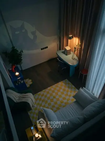 Cozy living room with modern decor and ambient lighting, featuring a stylish desk and comfortable seating.