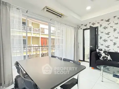 Modern living room with balcony view and stylish decor