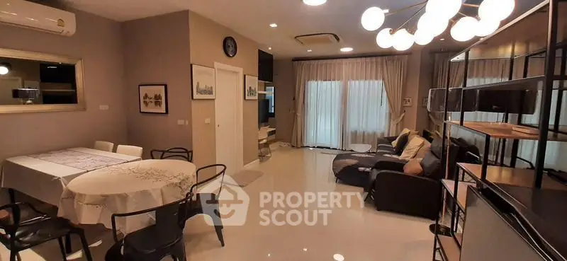 Spacious modern living room with elegant dining area and stylish lighting