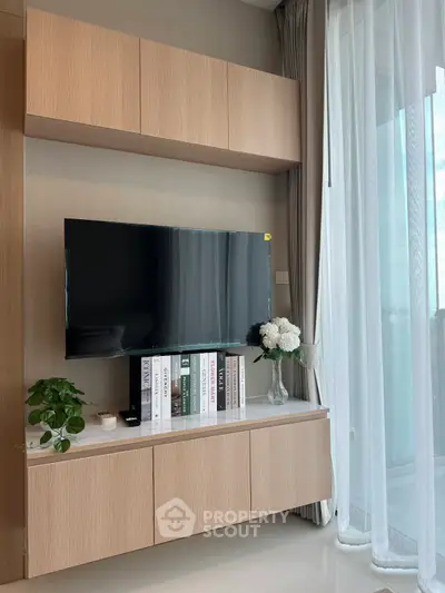 Modern living room with sleek TV setup and elegant decor