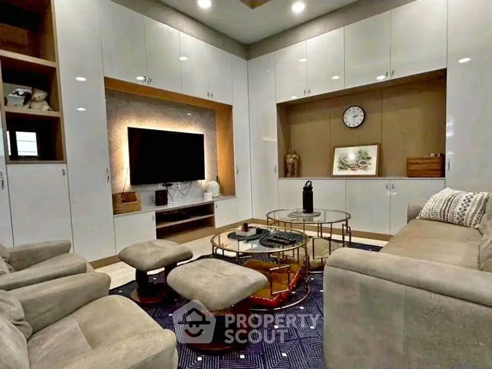 Luxurious living room with modern furniture and built-in entertainment center
