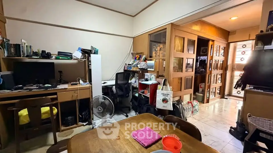 Cozy study room with wooden furniture and ample storage space