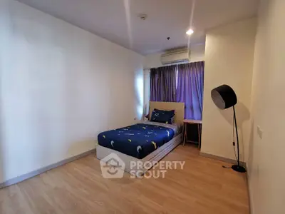 Cozy bedroom with single bed and modern decor in a bright apartment