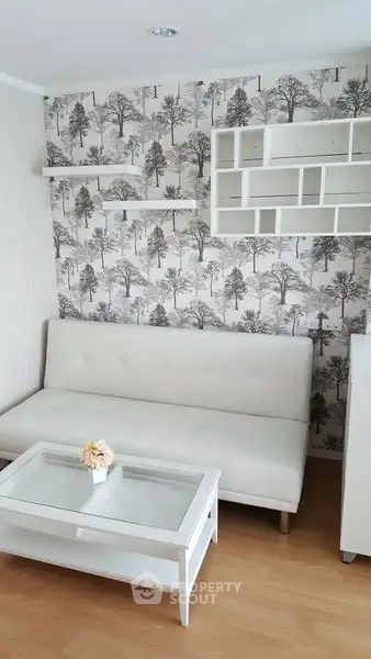 Stylish living room with white sofa and modern wall shelves