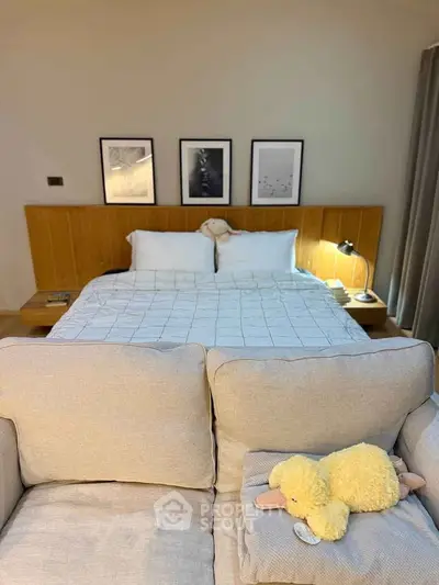 Cozy bedroom with stylish decor and plush bedding, perfect for relaxation and comfort.