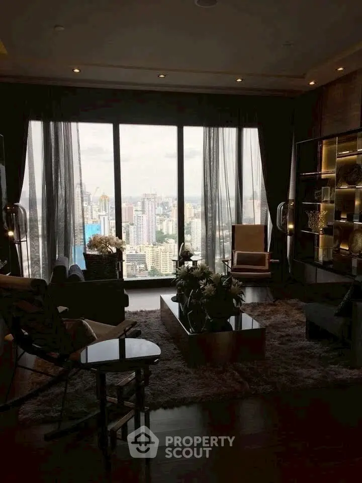 Luxurious living room with stunning city view and elegant decor.