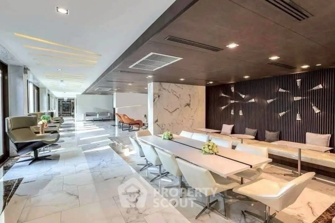 Luxurious modern living room with elegant marble flooring and stylish seating area.