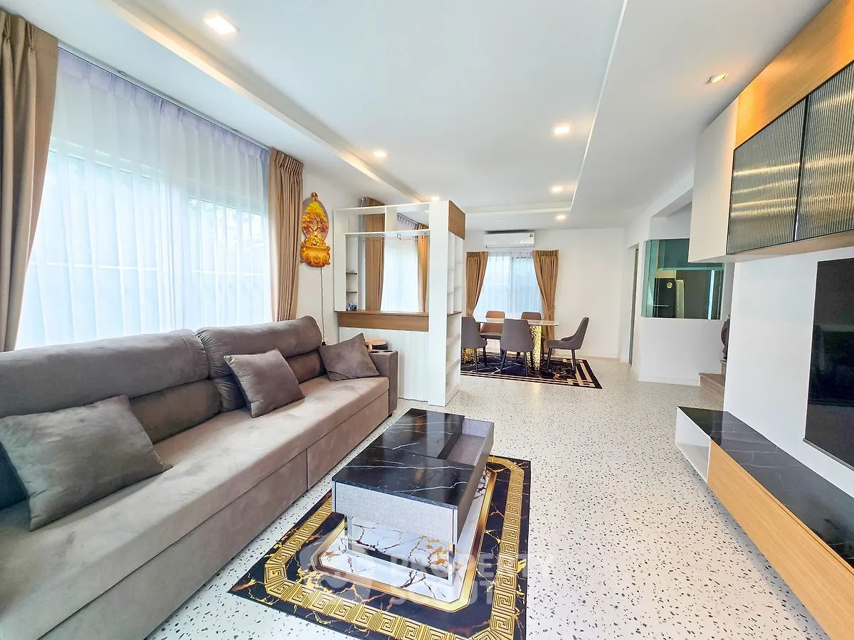 Spacious modern living room with elegant decor and large windows