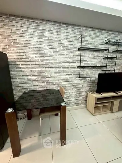 Modern living room with brick accent wall and sleek furniture