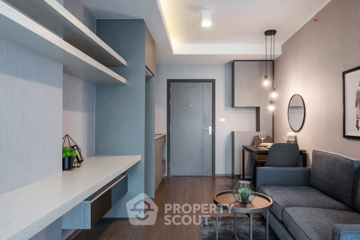 Modern living room with sleek furniture and stylish decor in a contemporary apartment.