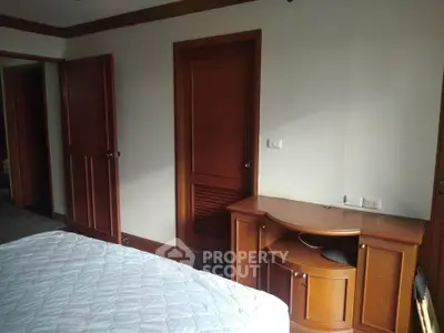 Cozy bedroom with wooden furniture and natural light