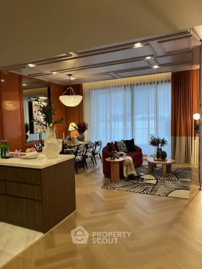 Luxurious open-plan living room with modern decor and elegant dining area