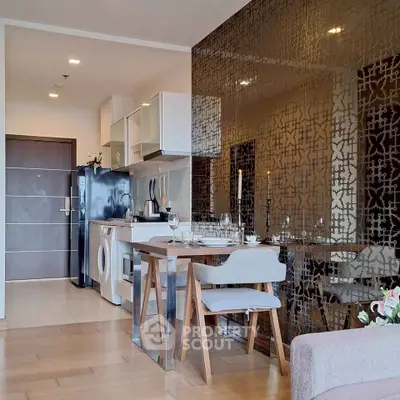 Modern open-plan kitchen with dining area and stylish decor