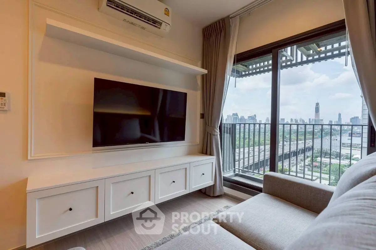 Modern living room with city view and sleek TV setup