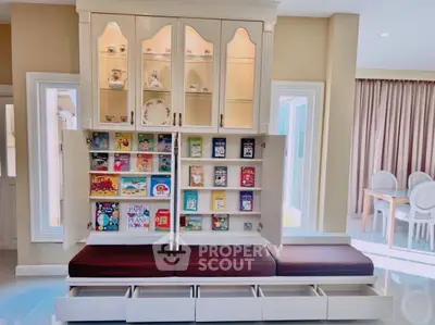 Elegant living room with built-in bookshelf and cozy seating area
