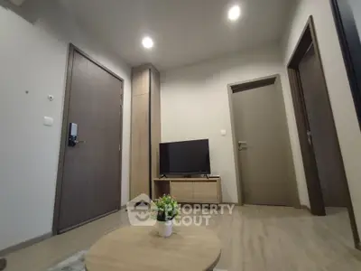 Modern living room with wooden flooring and minimalist decor