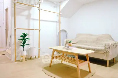 Cozy minimalist living room with wooden furniture and neutral decor