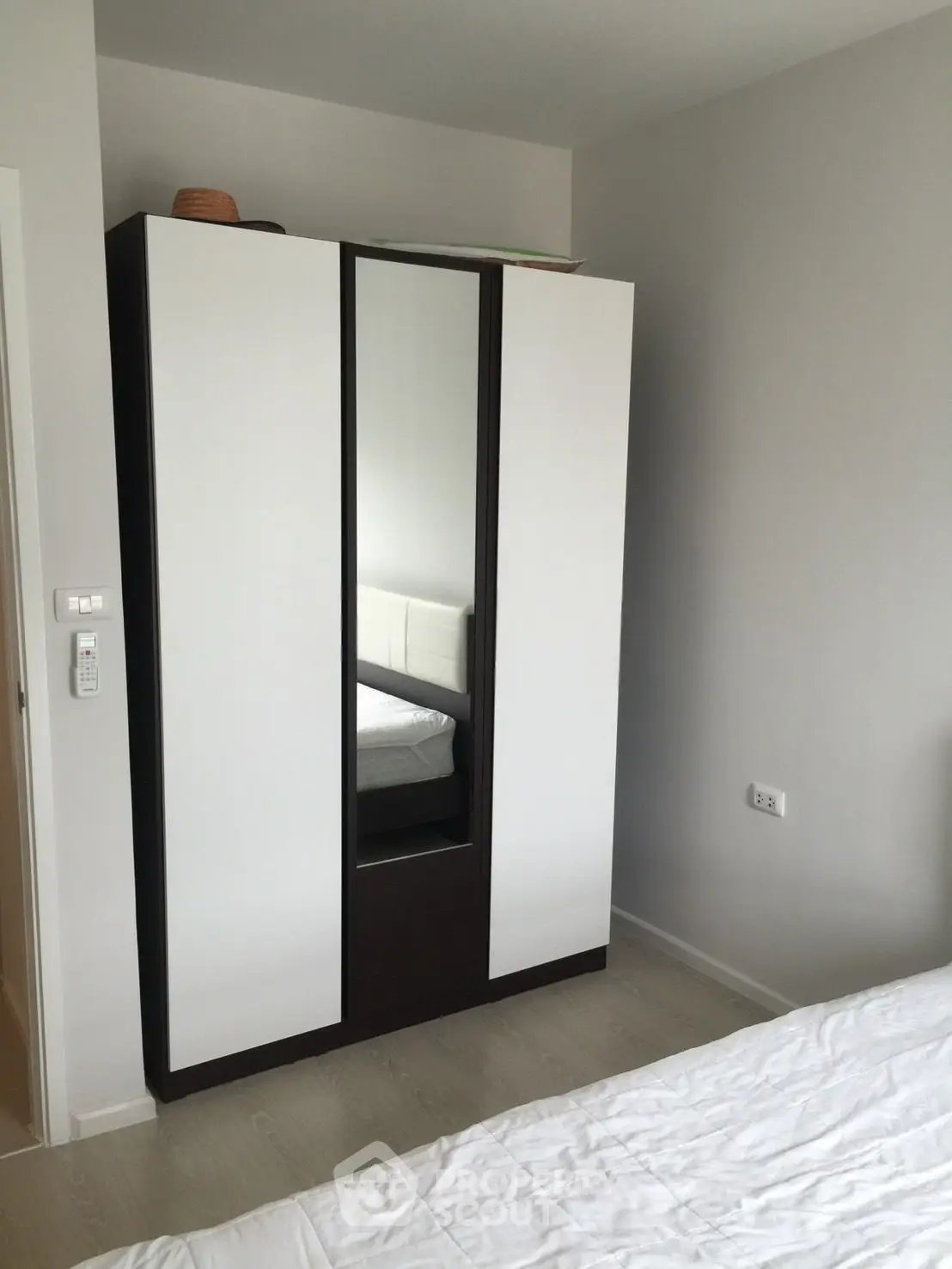 Modern bedroom with sleek wardrobe and minimalist design
