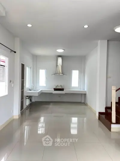 Spacious modern kitchen with sleek design and ample natural light