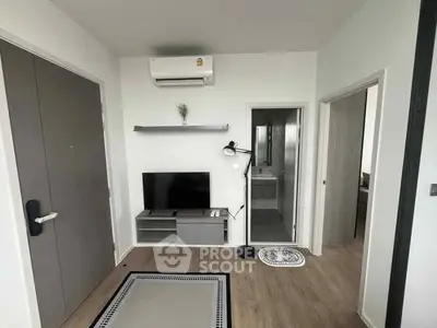 Modern apartment interior with TV, air conditioning, and sleek design