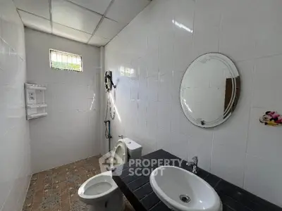 Spacious bathroom with modern fixtures and natural light