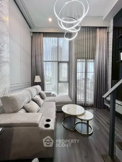 Luxurious high-rise living room with modern decor and stunning city view.