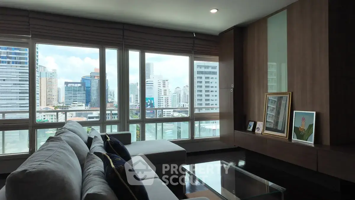 Spacious living room with panoramic city view and modern decor