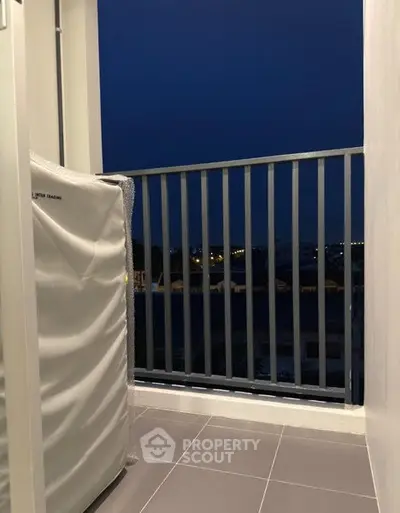 Charming balcony with night view, perfect for relaxation and enjoying city lights.