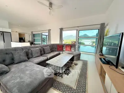 Spacious living room with stunning mountain views and modern furnishings.