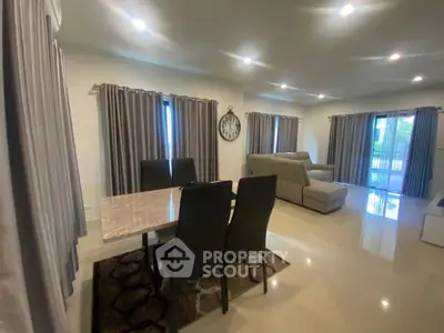 Spacious living room with elegant dining area and modern furnishings