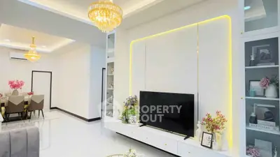 Luxurious living room with elegant chandelier and modern decor