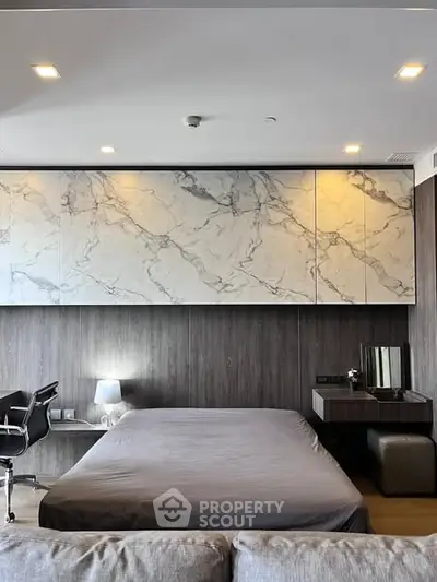 Modern bedroom with marble accents and sleek furnishings