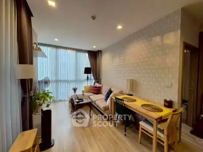 Stylish living room with modern decor and large windows for natural light