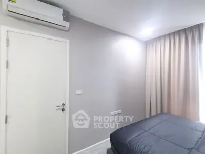 Modern bedroom with air conditioning and elegant curtains