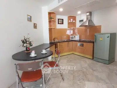 Charming kitchen with modern appliances and cozy dining area