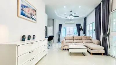 Spacious modern living room with elegant decor and ample natural light