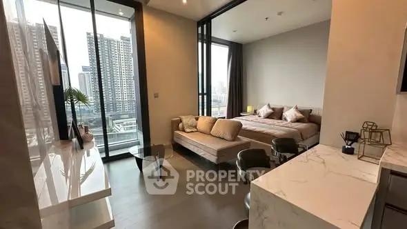 Luxurious modern studio apartment with stunning city view and elegant interior design.