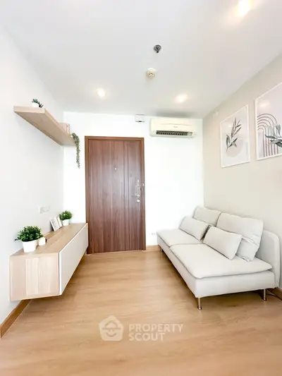 Modern minimalist living room with wooden floor and cozy sofa