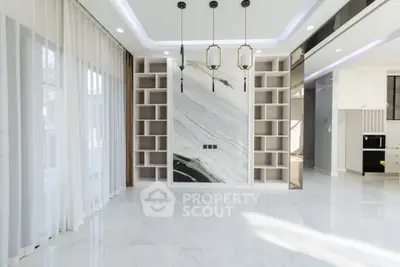 Luxurious modern living room with marble accents and elegant lighting