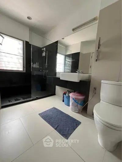 Modern bathroom with glass shower and sleek fixtures