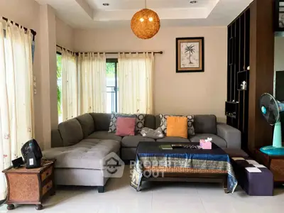 Spacious living room with modern sectional sofa and elegant decor