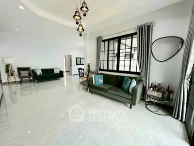 Spacious modern living room with elegant decor and large windows